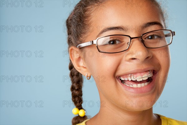 Studio portrait of girl laughing (10-11). Photo : Rob Lewine