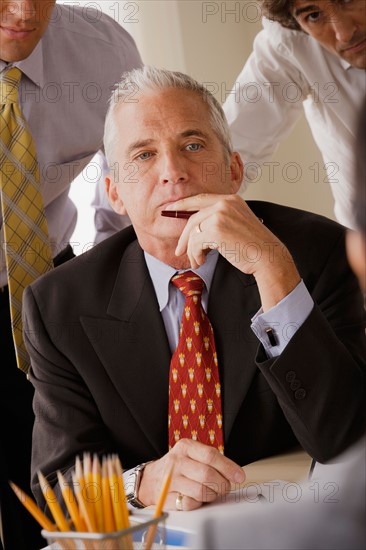 Businessmen at business meeting. Photo : Rob Lewine