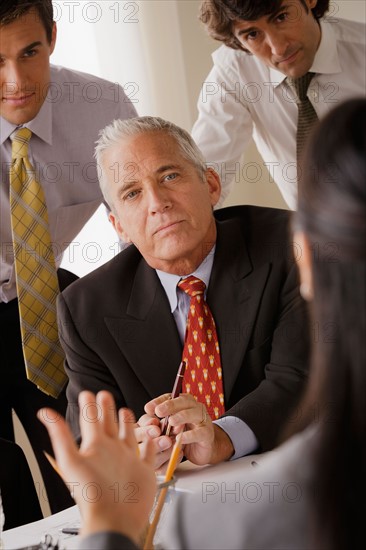 Businessmen at business meeting. Photo : Rob Lewine