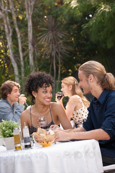 Couple dining in outdoor restaurant. Photo : Rob Lewine