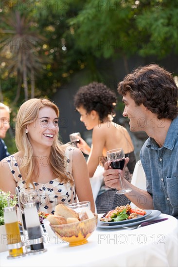 Couple dining in outdoor restaurant. Photo : Rob Lewine