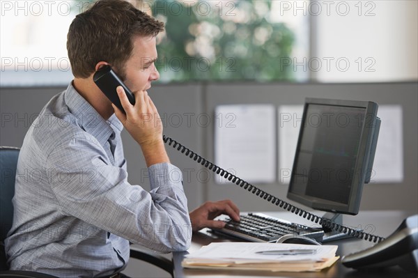 Young man working in office.