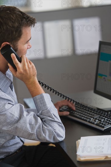 Young man working in office.