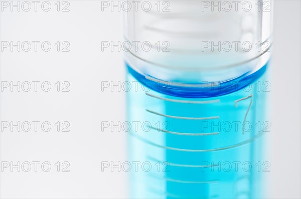 Studio shot of laboratory beaker with blue liquid. Photo: Antonio M. Rosario