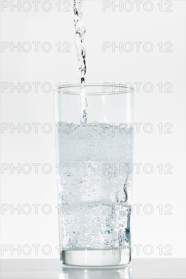 Studio shot of water being poured into glass.