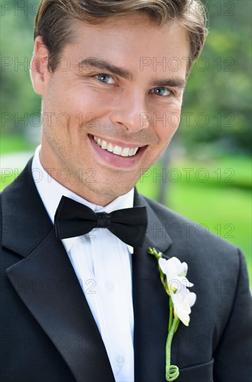 Close-up of smiling groom.