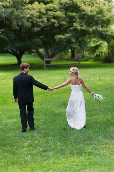 Newly wed couple walking together.