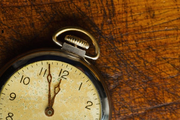 Old-fashioned pocket watch, studio shot.