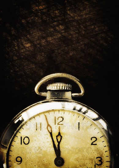 Old-fashioned pocket watch, studio shot.