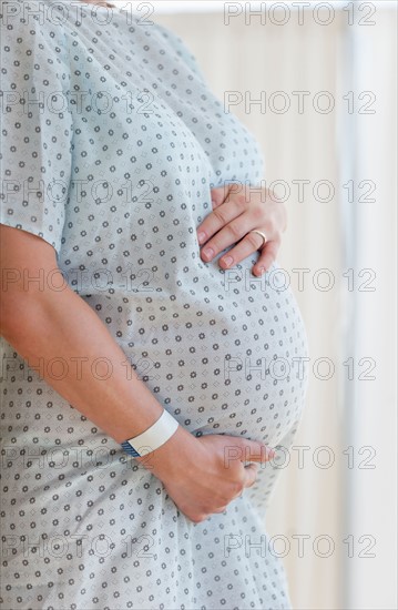 Close-up of pregnant woman in hospital.