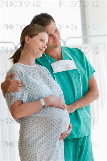 Pregnant woman with partner in hospital.