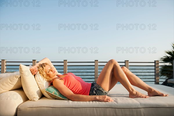 Young attractive woman sunbathing.