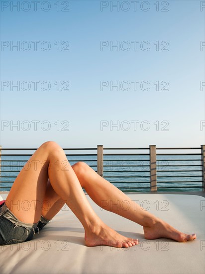 Young attractive woman sunbathing.