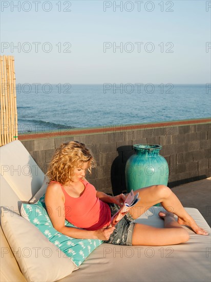 Young attractive woman sunbathing.