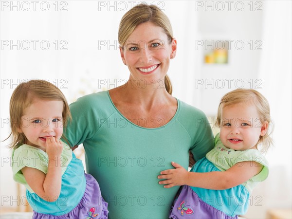 Portrait of mother with daughters (2-3).