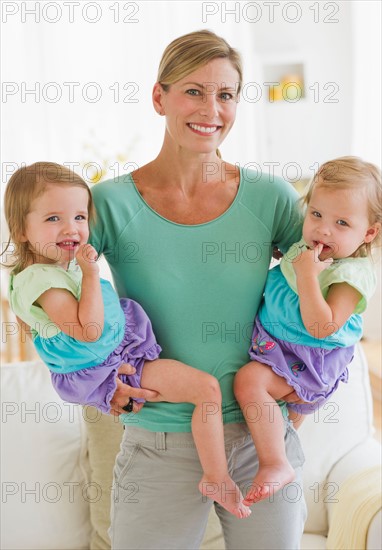 Portrait of mother with daughters (2-3).