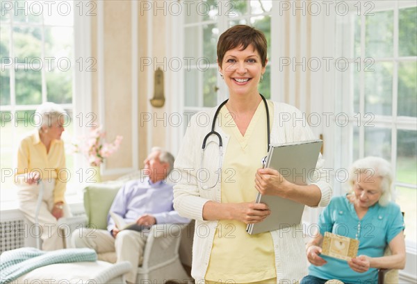 Nurse and senior people in nursing home.