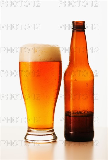 Studio shot of bitter ale in bottle and glass.