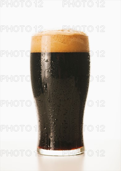 Studio shot of dark beer in glass.