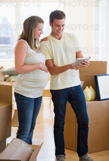 Young couple unpacking.