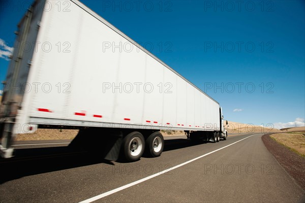 USA, Oregon, Wasco, Lorry travelling through rural landscape.