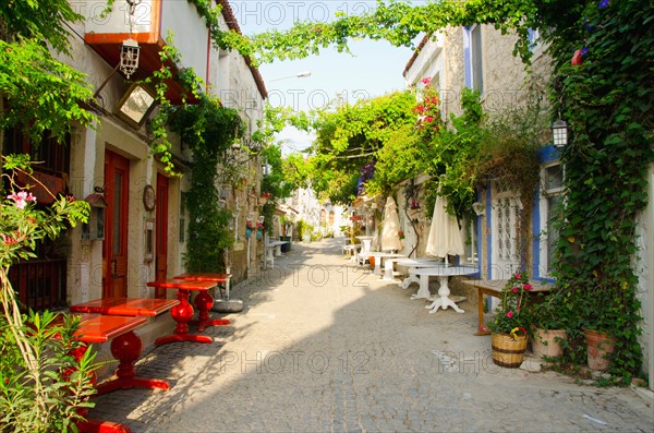 Turkey, Cesme, Alacati, traditional alley in village. Photo : Tetra Images