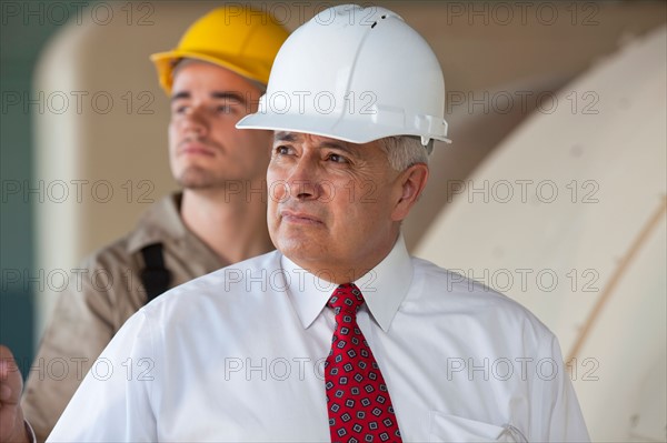 Portrait of manual worker and manager. Photo: db2stock