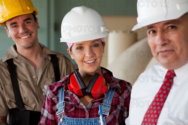 Portrait of manual workers and manager. Photo : db2stock