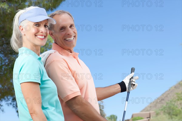 Portrait of couple on golf course. Photo: db2stock