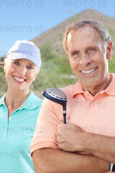 Portrait of couple on golf course. Photo: db2stock