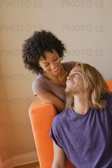 Young couple in living room. Photo : Rob Lewine