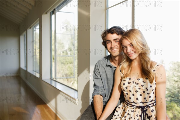 Portrait of young couple in empty home. Photo: Rob Lewine