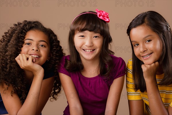 Studio portrait of three girls (10-11). Photo: Rob Lewine