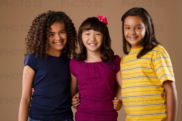 Studio portrait of three girls (10-11). Photo: Rob Lewine