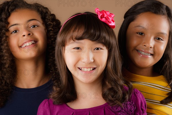 Studio portrait of three girls (10-11). Photo: Rob Lewine