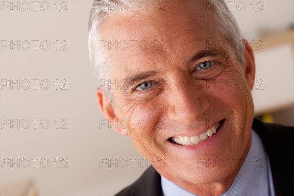 Studio portrait of senior businessman. Photo : Rob Lewine