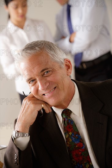 Portrait of smiling senior businessman. Photo : Rob Lewine