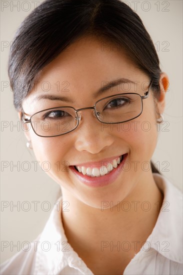Portrait of young smiling businesswoman. Photo : Rob Lewine