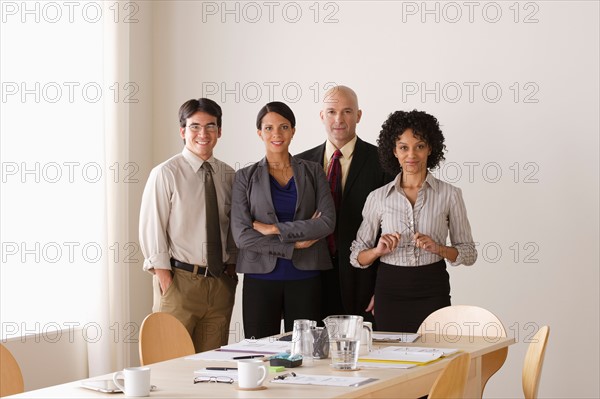 Portrait of business team in board room. Photo : Rob Lewine