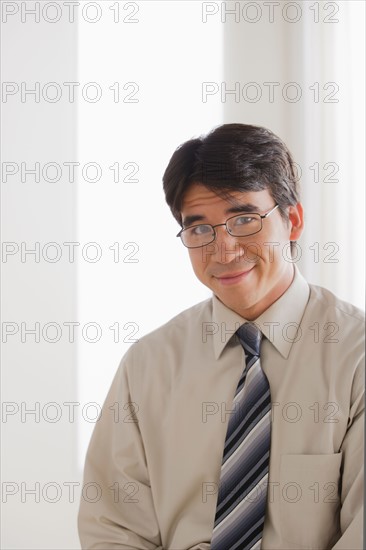 Portrait of business man smiling. Photo : Rob Lewine