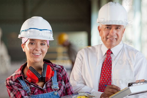 Portrait of manual worker and manager. Photo: db2stock