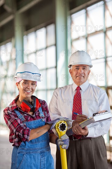 Portrait of manual worker and manager. Photo: db2stock