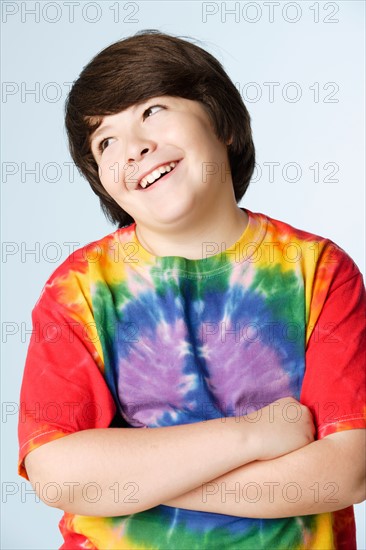 Studio portrait of boy (10-11) in colorful shirt. Photo: Rob Lewine