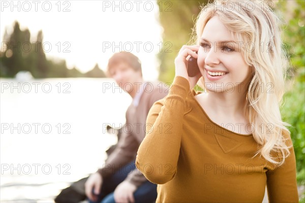 Young woman talking on phone. Photo: Take A Pix Media