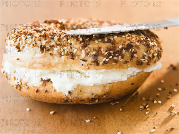 Close up of bagel with cream cheese. Photo : Jamie Grill