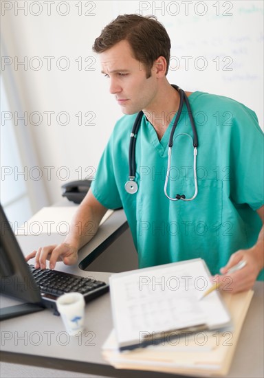 Doctor using computer.