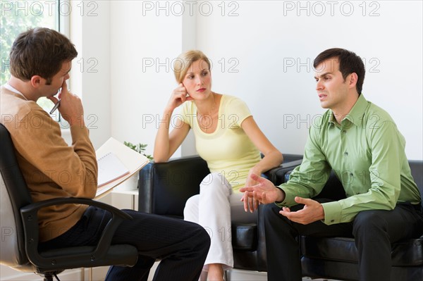 Couple discussing issues during therapy.