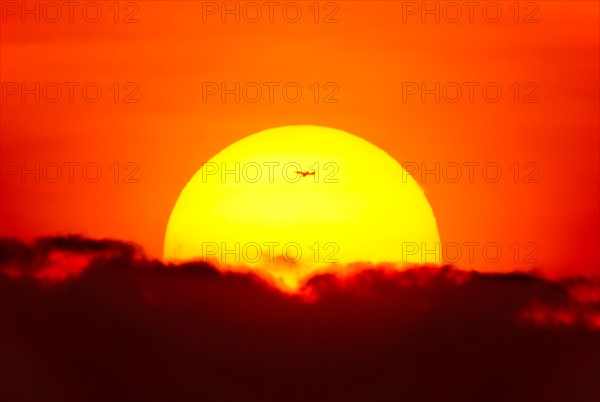 Large sun at sunset.