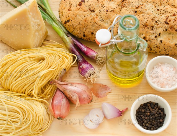 Pasta, cheese, garlic and olive oil, studio shot.