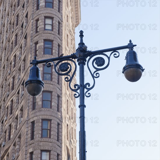 USA, New York City, Lamp post in front of Flatiron Building.